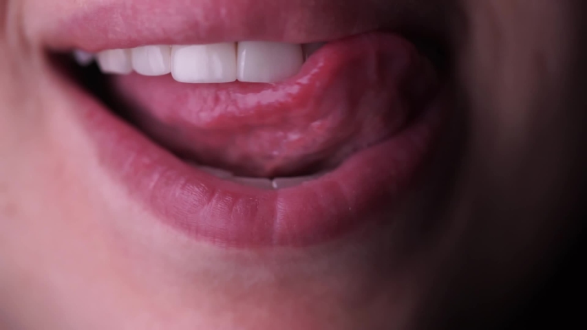 Young Teen Licking Teeth